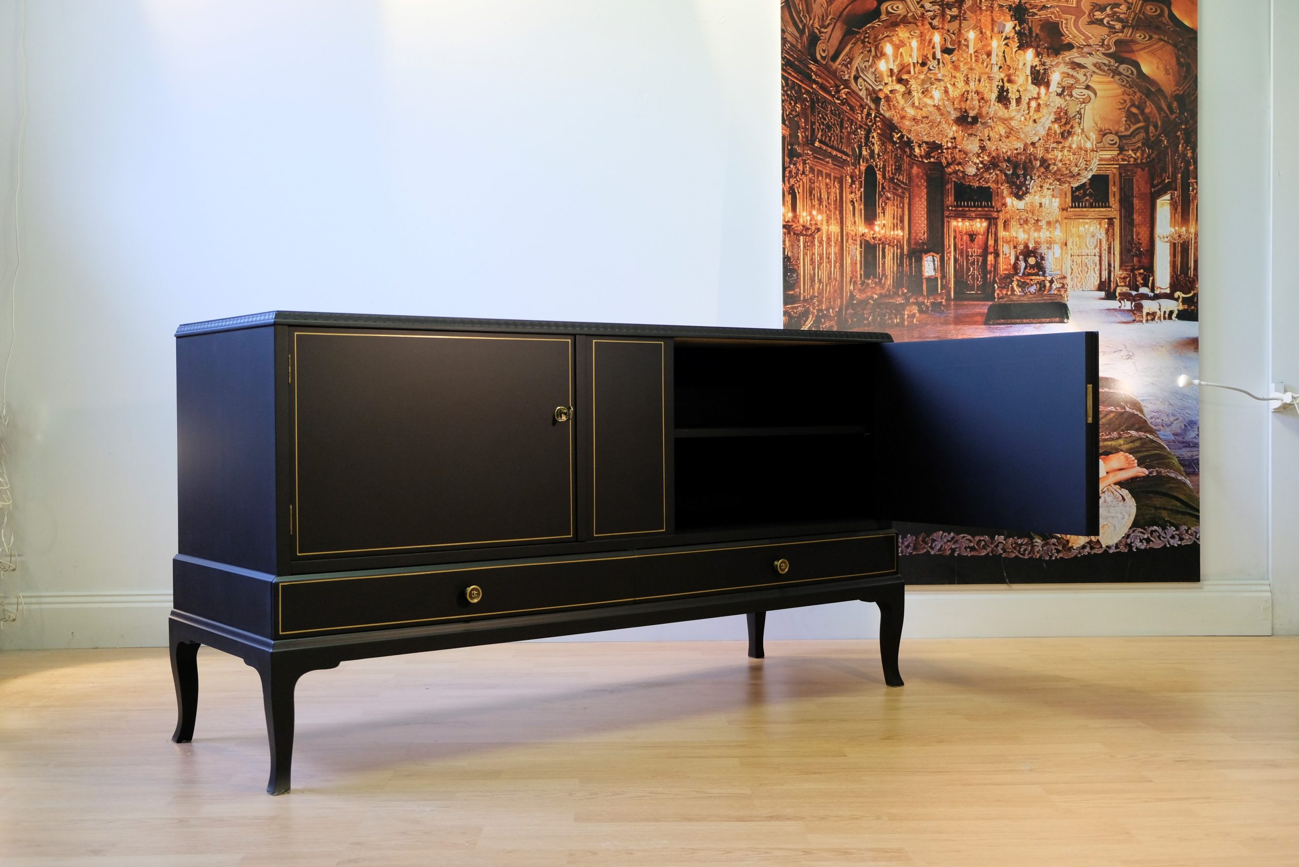Art déco sideboard in matt black with gold frames